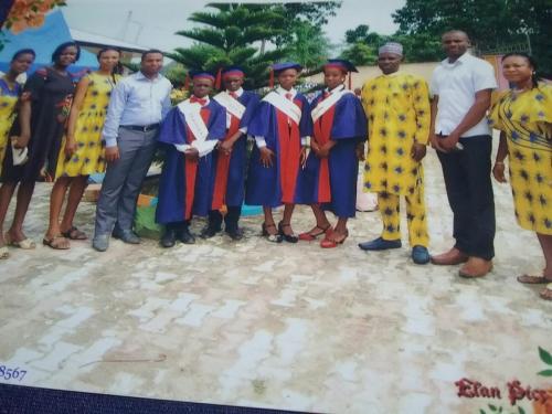 Ptf chairman, Ptf chairperson, directors and  teachers posing with Graduands